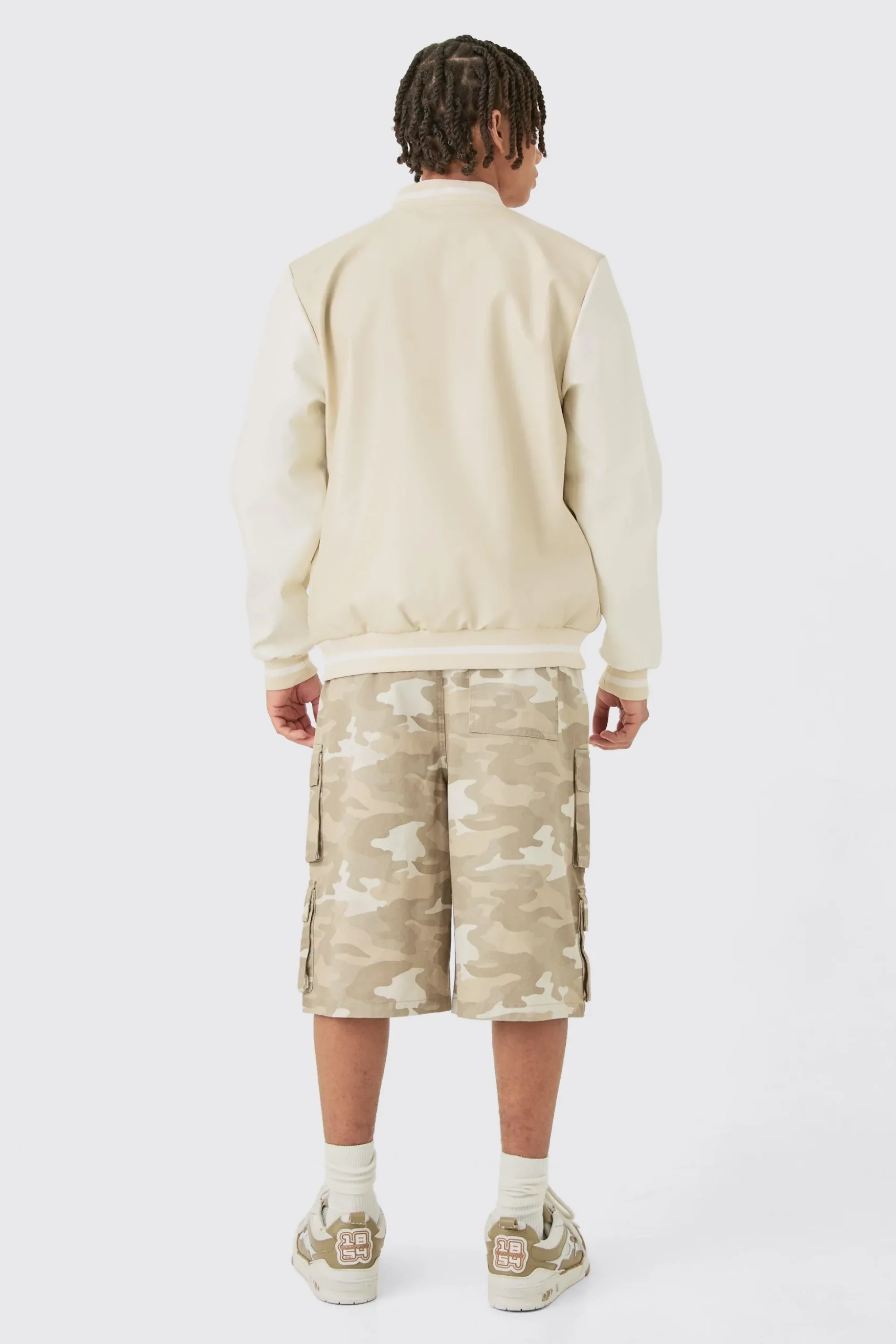 Plain PU Varsity Jacket In Beige | BoohooMAN UK