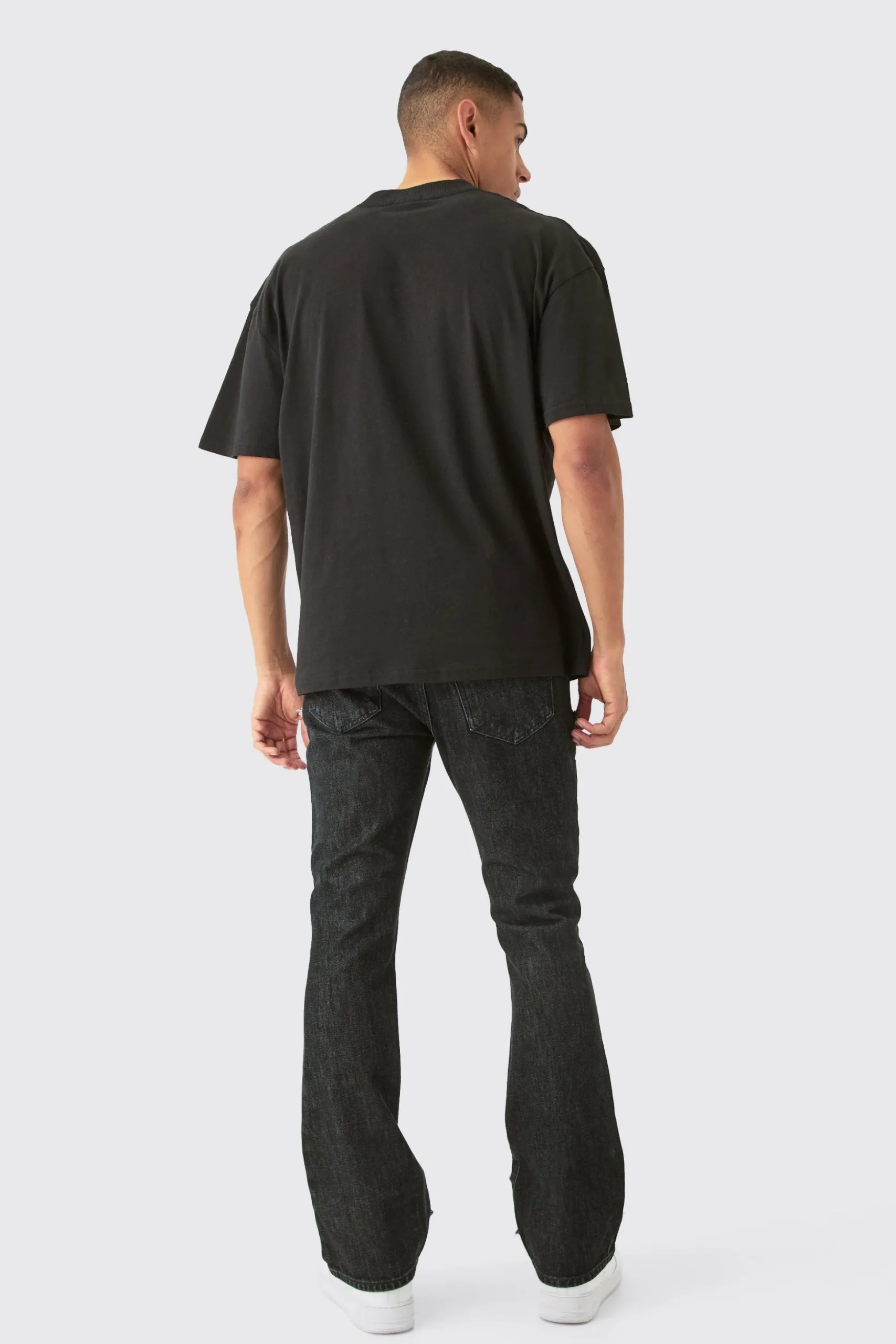 Slim Rigid Flare Ripped Carpenter Overdye Denim Jean In Black | BoohooMAN UK
